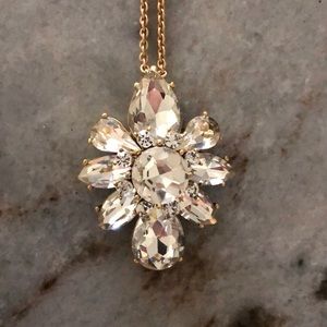 Long gold necklace with crystal design